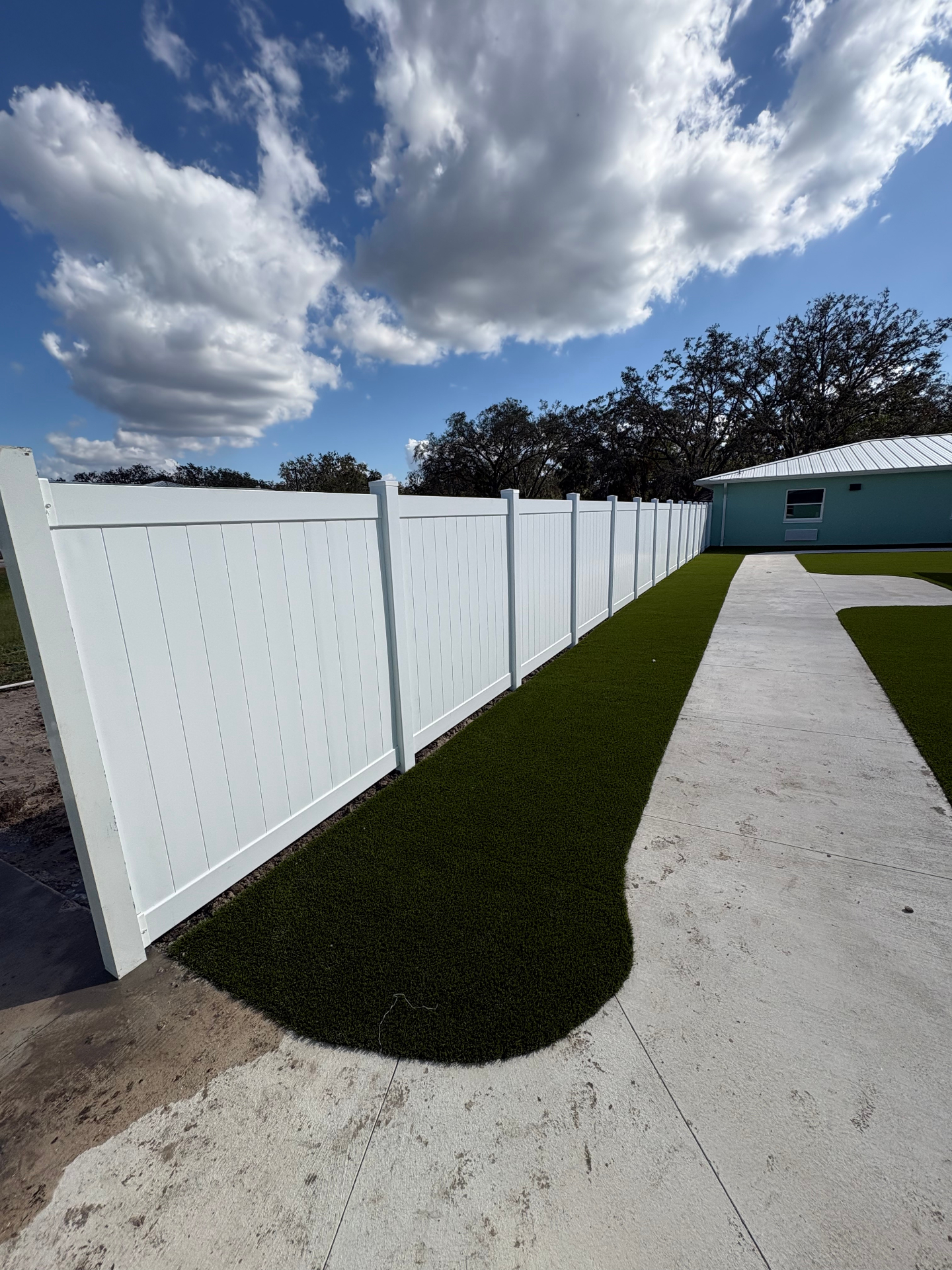White vinyl privacy fence installation in Central Florida