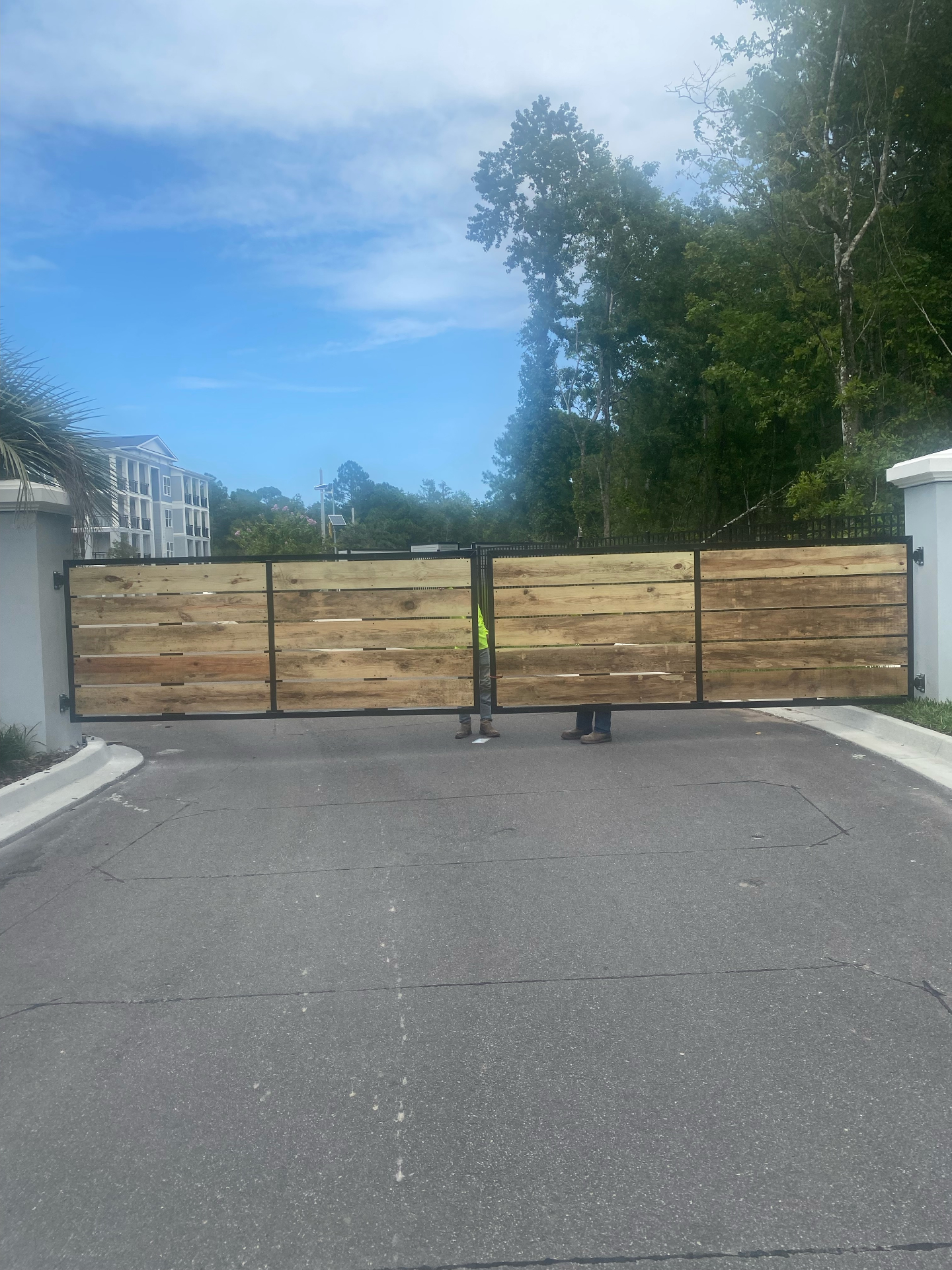 Custom wood and steel frame driveway gate